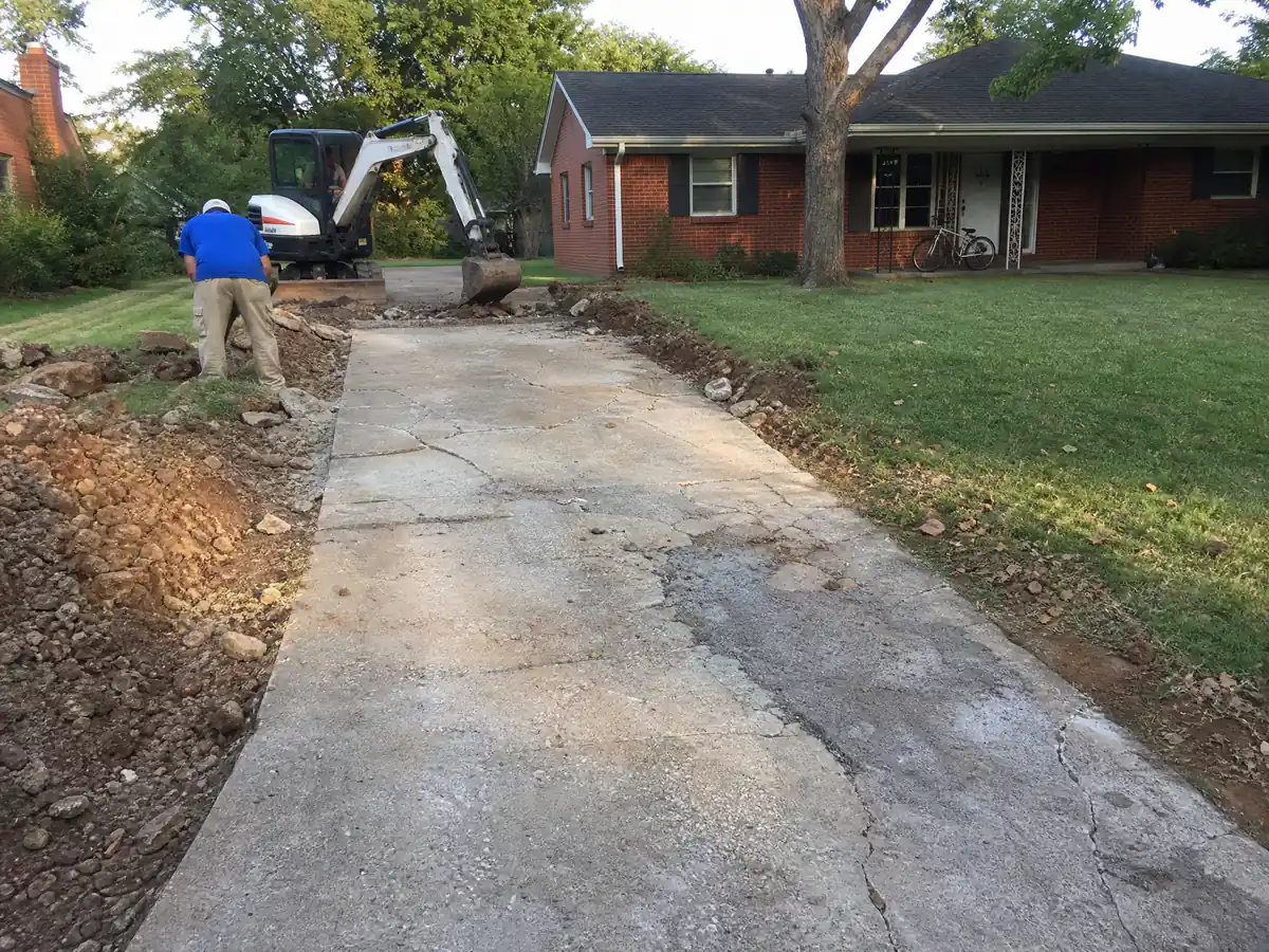 Sixty-year-old cracked concrete driveway at a 1960s ranch house in central Norman, Oklahoma