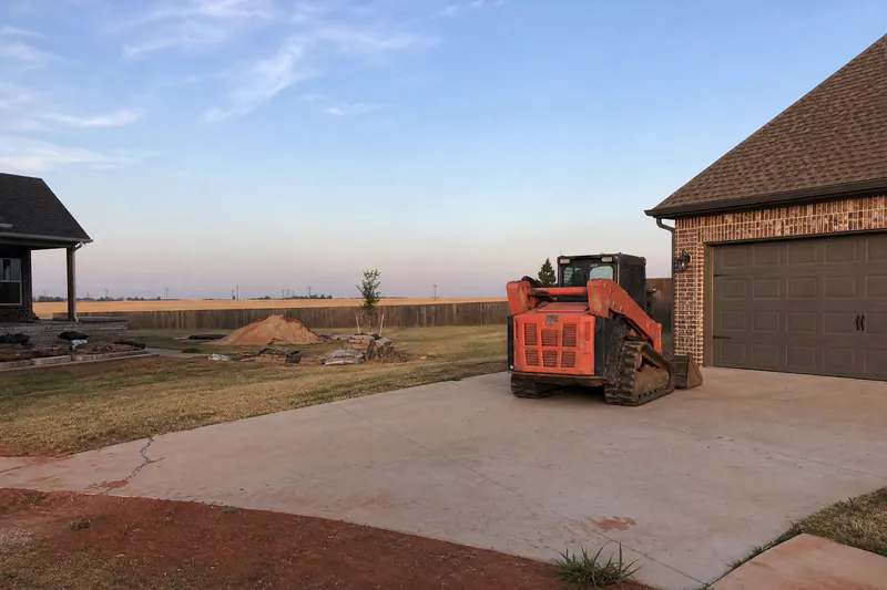Early cracking in a newer concrete driveway in a west-side subdivision on former farmland in Yukon, Oklahoma