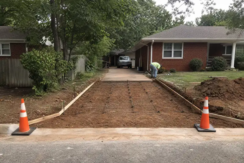 Driveway apron formed and reinforced at the street curb, ready for concrete, in an older Oklahoma City neighborhood
